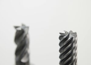 Detailed view of spiral metal drill bits used in precision machining and metalworking.